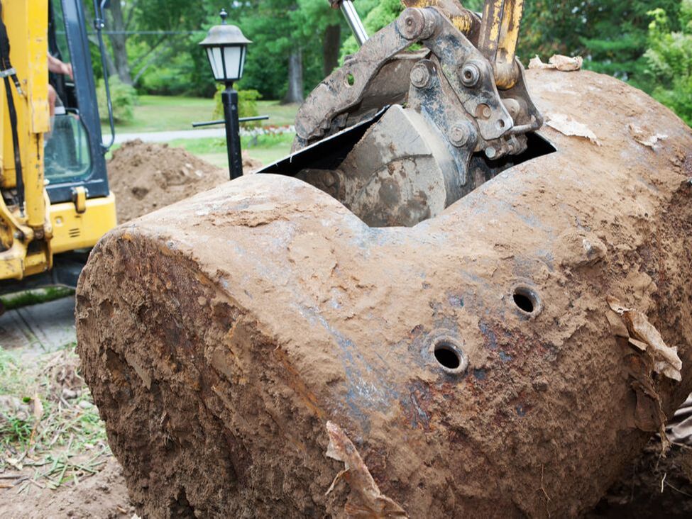 Removing old septic system with powered equipment